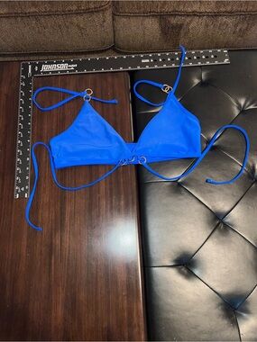 Bright Blue Triangle Bikini Top with metal ring details. Bold